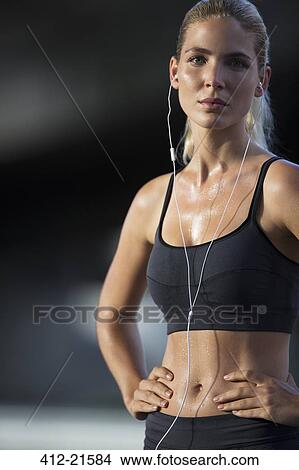 Picture - Woman resting after exercising. Fotosearch