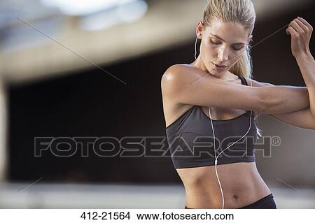 Woman stretching arms before exercise View Large Photo Image Picture - Woman stretching arms before exercise. Fotosearch