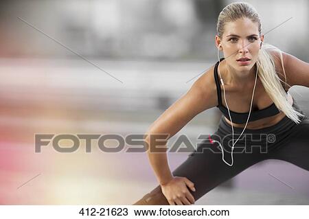 Woman stretching before exercising View Large Photo Image Stock Image - Woman stretching before exercising. Fotosearch