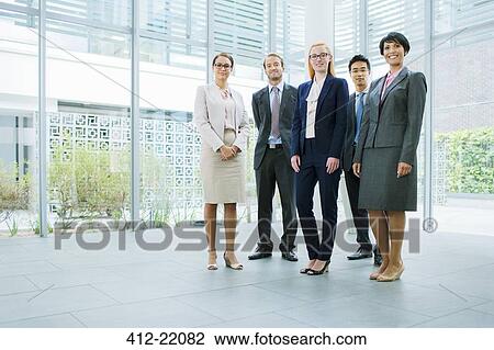 Business people gathered in office building View Large Photo Image Stock Image - Business people gathered in office building. Fotosearch
