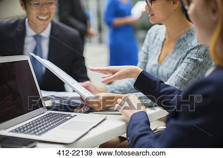 Business people having meeting in office building View Large Photo Image Stock Photo - Business people having meeting in office building. Fotosearch