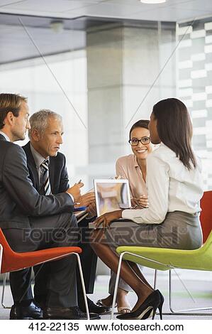 Business people having meeting in office building View Large Photo Image Stock Photography - Business people having meeting in office building. Fotosearch