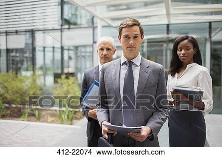Business people outside of office building View Large Photo Image Picture - Business people outside of office building. Fotosearch