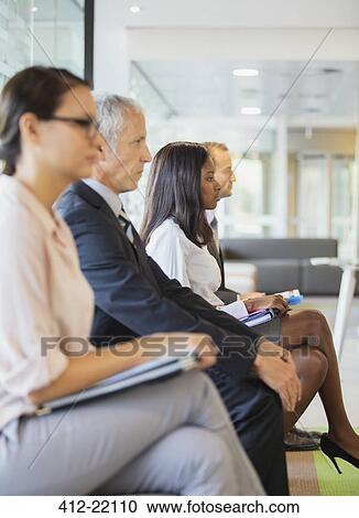 Business people sitting in office together View Large Photo Image Stock Image - Business people sitting in office together. Fotosearch