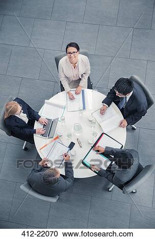 Business people talking in meeting at table View Large Photo Image Stock Image - Business people talking in meeting at table. Fotosearch
