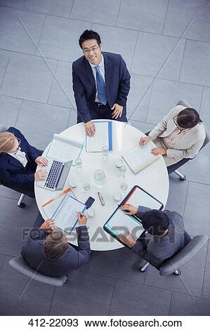 Business people talking in meeting at table View Large Photo Image Stock Image - Business people talking in meeting at table. Fotosearch