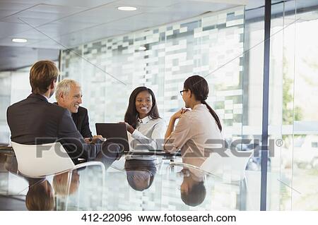 Business people talking in meeting in office building View Large Photo Image Stock Photograph - Business people talking in meeting in office building. Fotosearch