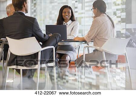Business people talking in meeting View Large Photo Image Stock Photo - Business people talking in meeting. Fotosearch