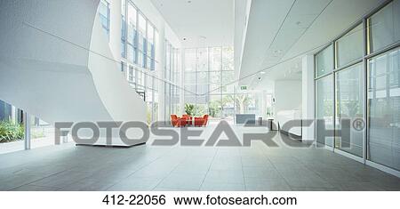 Light shining through windows in office building View Large Photo Image Stock Photograph - Light shining through windows in office building. Fotosearch