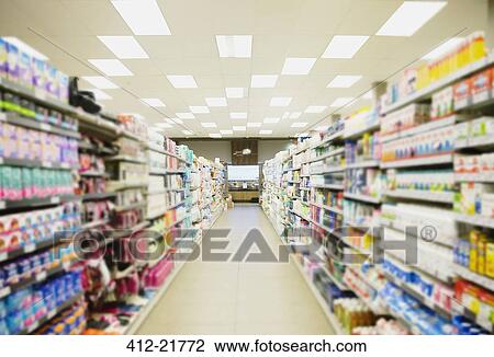 Defocussed view of grocery store aisle View Large Photo Image Stock Image - Defocussed view of grocery store aisle. Fotosearch