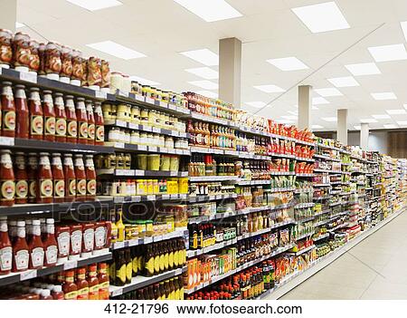 Stocked shelves in grocery store aisle View Large Photo Image Stock Photograph - Stocked shelves in grocery store aisle. Fotosearch