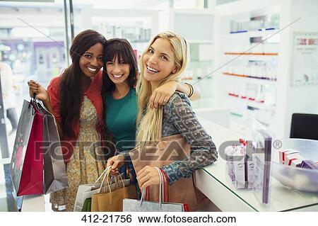 Stock Photograph - Women shopping together in drugstore. Fotosearch
