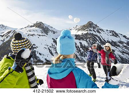 Family having a snowball fight on mountain View Large Photo Image Stock Image - Family having a snowball fight on mountain. Fotosearch