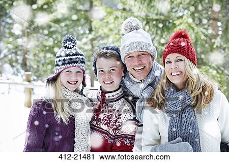Family hugging in the snow View Large Photo Image Stock Image - Family hugging in the snow. Fotosearch