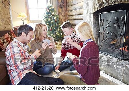 Family playing card game together View Large Photo Image Stock Image - Family playing card game together. Fotosearch