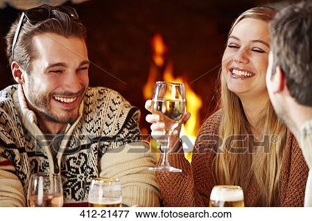 Friends enjoying a meal together View Large Photo Image Stock Photo - Friends enjoying a meal together. Fotosearch