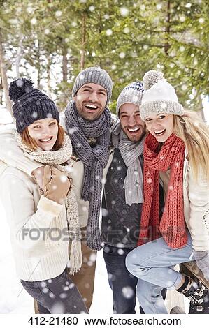 Friends hugging in the snow View Large Photo Image Stock Image - Friends hugging in the snow. Fotosearch