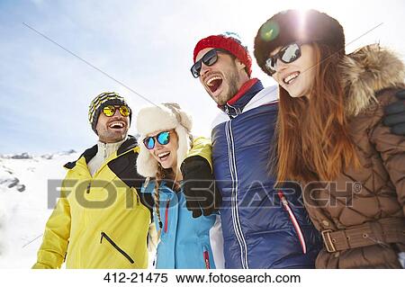 Friends hugging in the snow View Large Photo Image Stock Photography - Friends hugging in the snow. Fotosearch