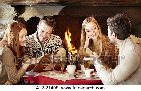 Friends ordering food at restaurant View Large Photo Image Stock Photo - Friends ordering food at restaurant. Fotosearch