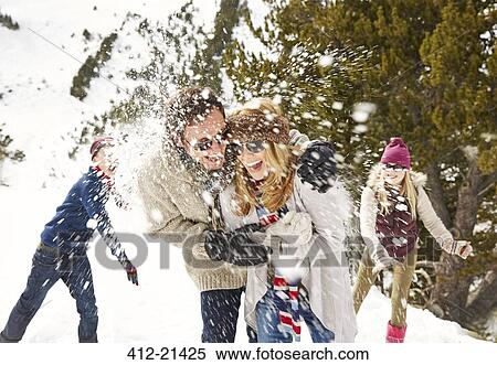 Stock Photography - Friends playing in the snow . Fotosearch