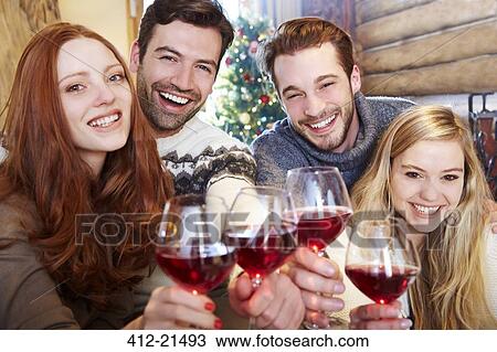 Friends toasting each other with wine View Large Photo Image Stock Image - Friends toasting each other with wine. Fotosearch