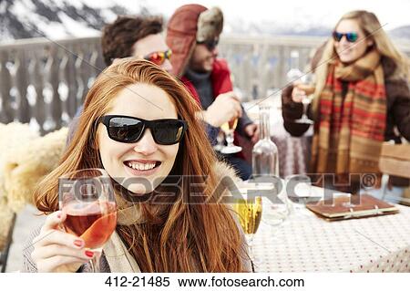 Woman enjoying drinks with friends View Large Photo Image Stock Photography - Woman enjoying drinks with friends. Fotosearch