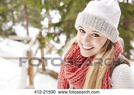Woman smiling in the snow View Large Photo Image Stock Image - Woman smiling in the snow. Fotosearch