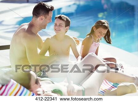 Family with two children by swimming pool View Large Photo Image Stock Image - Family with two children by swimming pool. Fotosearch