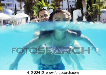 Portrait of girl and her father in swimming pool View Large Photo Image Stock Image - Portrait of girl and her father in swimming pool. Fotosearch