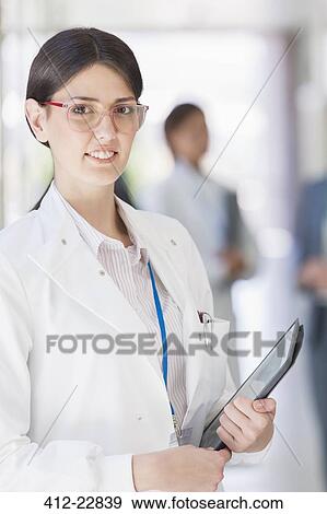 Stock Photo - Scientist holding tablet computer. Fotosearch