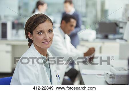 Scientist smiling in laboratory View Large Photo Image Stock Photo - Scientist smiling in laboratory. Fotosearch