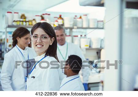 Scientist smiling in laboratory View Large Photo Image Stock Photograph - Scientist smiling in laboratory. Fotosearch