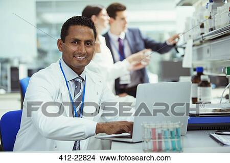 Scientist working on laptop in laboratory View Large Photo Image Picture - Scientist working on laptop in laboratory. Fotosearch