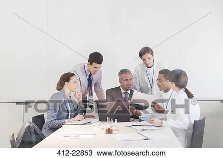 Scientists and business people talking in conference room View Large Photo Image Stock Image - Scientists and business people talking in conference room. Fotosearch
