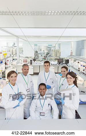 Picture - Scientists smiling in laboratory. Fotosearch