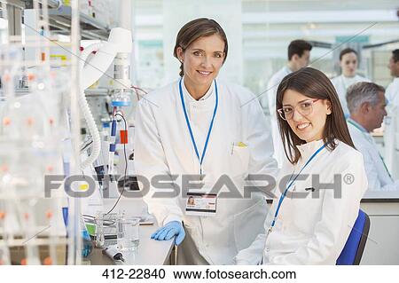 Scientists smiling in laboratory View Large Photo Image Stock Image - Scientists smiling in laboratory. Fotosearch