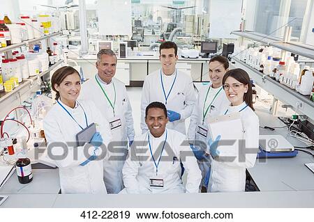Scientists smiling in laboratory View Large Photo Image Stock Photo - Scientists smiling in laboratory. Fotosearch
