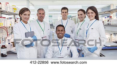 Scientists smiling in laboratory View Large Photo Image Stock Photograph - Scientists smiling in laboratory. Fotosearch