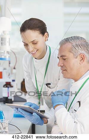Scientists using digital tablet in laboratory View Large Photo Image Stock Image - Scientists using digital tablet in laboratory. Fotosearch