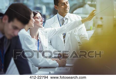 Scientists working in laboratory View Large Photo Image Picture - Scientists working in laboratory. Fotosearch