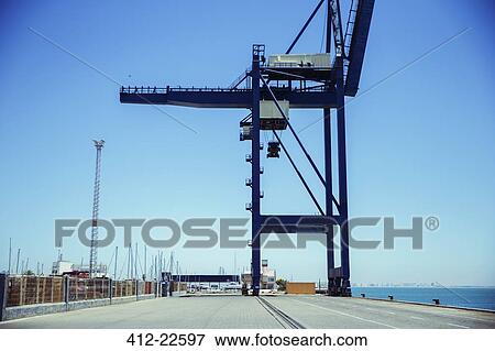 Stock Photo - Cargo crane at waterfront. Fotosearch