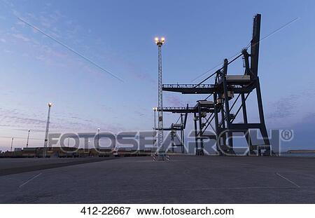 Cargo cranes at night View Large Photo Image Stock Photo - Cargo cranes at night. Fotosearch