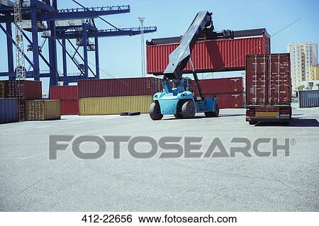 Crane lifting cargo container View Large Photo Image Stock Photograph - Crane lifting cargo container. Fotosearch