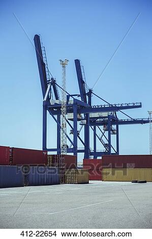 Cranes over cargo containers View Large Photo Image Picture - Cranes over cargo containers. Fotosearch