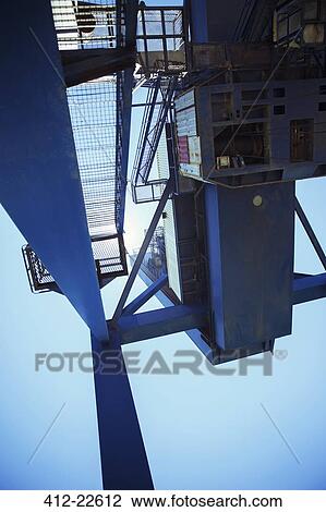 Low angle view of cargo crane View Large Photo Image Stock Image - Low angle view of cargo crane. Fotosearch