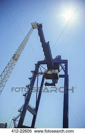 Low angle view of cargo crane View Large Photo Image Stock Photography - Low angle view of cargo crane. Fotosearch