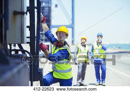 Worker climbing cargo crane View Large Photo Image Stock Image - Worker climbing cargo crane. Fotosearch