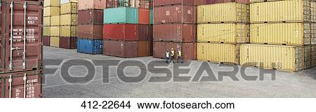 Workers walking near cargo containers View Large Photo Image Picture - Workers walking near cargo containers. Fotosearch