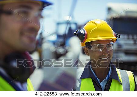 Workers with walkie-talkie View Large Photo Image Stock Image - Workers with walkie-talkie. Fotosearch