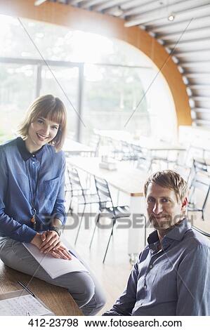 Business people smiling in cafeteria View Large Photo Image Stock Photo - Business people smiling in cafeteria. Fotosearch